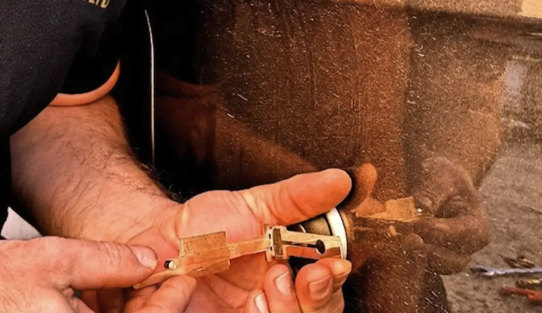 Cutting a replacement car key at the roadside